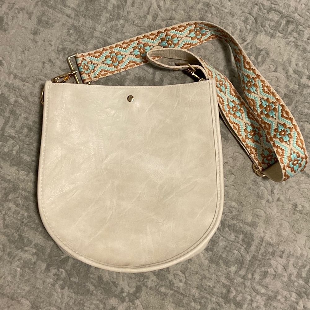 Ahdorned double entry U Shaped Crossbody Bag.
